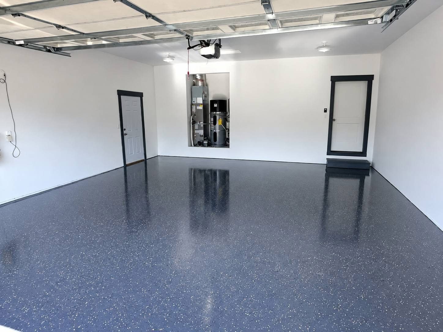 Same garage after floor coating renovation by Against The Grain Contracting