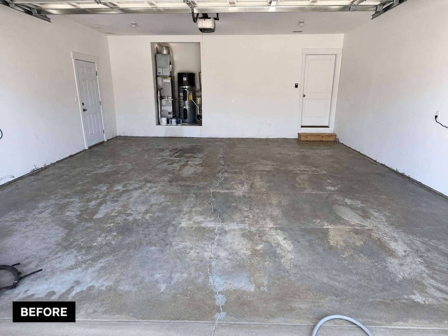 Garage floor before renovation, bare concrete